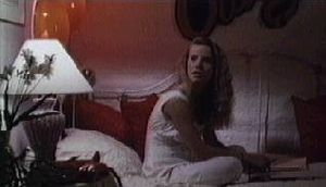 Amanda Peterson : wearing pijama and sitting on her bed