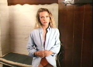 Amanda Peterson : at the locker wearing an unbuttoned blue shirt