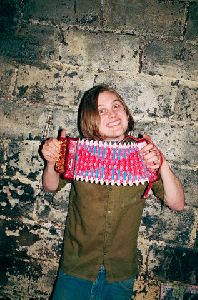 Michael Pitt  Playing a small pink Toy Accordion