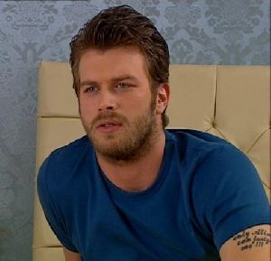 Kivanc Tatlitug in a blue top