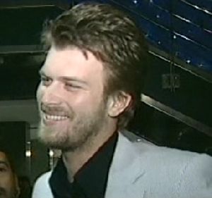 Kivanc Tatlitug smiling at a TV interview