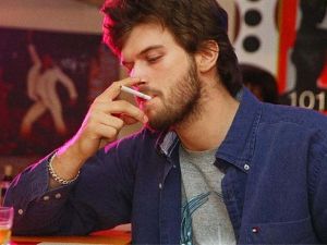 Kivanc Tatlitug smoking cigerette