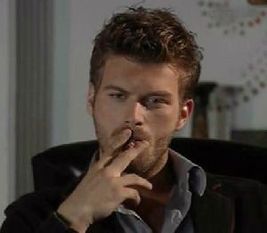 Kivanc Tatlitug smoking cigerrette