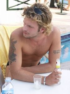 Kivanc Tatlitug at the pool in a swimming suit