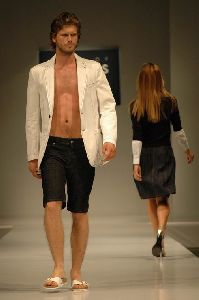 Kivanc Tatlitug on the runway at a fashion show