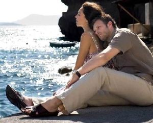 Azra Akin on the beach hugged by her boyfriend Kivanc Tatlitug