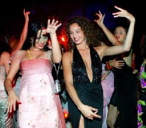 Azra Akin dancing at the pre-announcement party of 2002 miss world