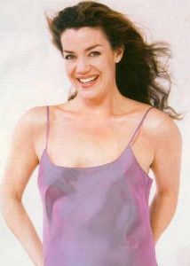 Claudia Christian in a light purple dress