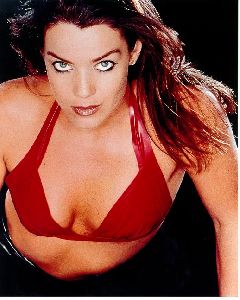 Claudia Christian red top that shows her breast cleavage