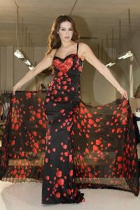 Roula Saad modeling a red floral dress