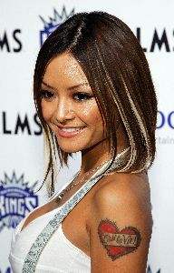 Tila Tequila large high quality photo posing at Gavin Maloof's Housewarming Party on October 25, 2007