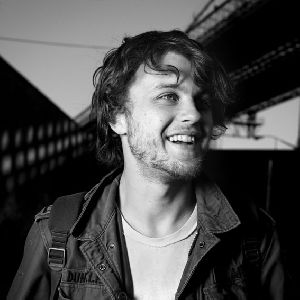 Michael Pitt smiling black and white picture