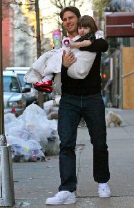 Suri Cruise carried by father Tom Cruise