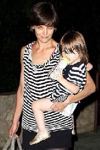 Suri Cruise with mommy wearing matching white and black dress