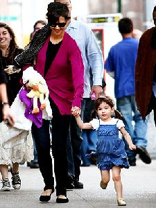 Suri Cruise wearing a summer blue dress