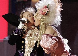 Thalia with a dancer licking her cheeck live in a concert