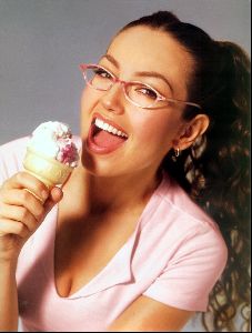 Thalia looking cute with eyeglasses eating an icecream cone