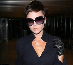 VICTORIA BECKHAM : seen arriving at LAX airport, wearing large black sunglasses and a leather on the 6th of December of 2008