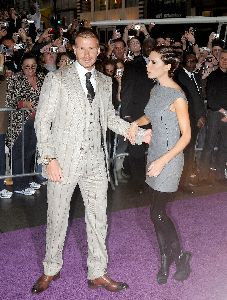 VICTORIA BECKHAM : posing for the camera with husband David Beckham at the Launch  Signature  in new york city