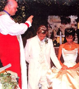 VICTORIA BECKHAM : at the chair on her wedding day