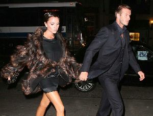 VICTORIA BECKHAM : arriving at Nobu restaurant with David Beckham wearing a stylish brown fur jacket and a high heel black shoe on November 2008