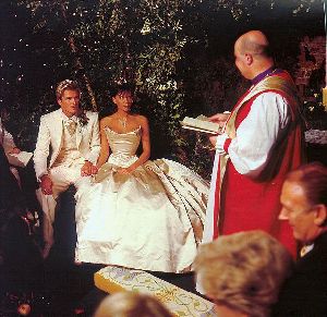 VICTORIA BECKHAM : seated with David beckham at her wedding