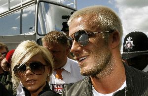 VICTORIA BECKHAM : a large high quality picture of the BLOND couple Victoria and David Beckham at the With David Beckham at British Formula 1 Grand Prix