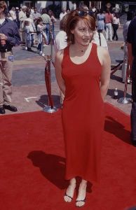 Linda Kozlowski : on the red carpet wearing a red dress