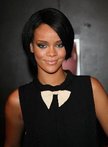 Rihanna cute black dress and a white ribbon at the collar