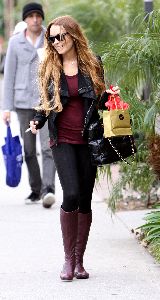 Lindsay Lohan : spotted shopping yesterday 3rd January 2009 wearing a tight black leggings and maroon stretch top and a dark maroon long low-heel boots