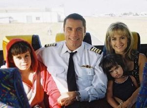 Jett Travolta at 10 years old with his mother and father