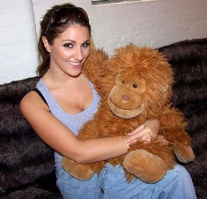 Lucy Pinder hugging her large monkey soft toy