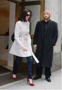 Anne Hathaway : accompanied by a bodyguard heading towards a building in New York City, yesterday s afternoon 5th January 2009