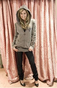 Ashley Tisdale in a gray sweater