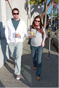 Alyson Hannigan baby bump with husband Alexis Denisof