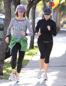 Reese Witherspoon running at the street with her personal trainer on Jan 6th 2009