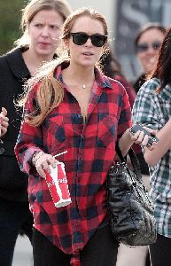 Lindsay Lohan : spotted wearing a black tight leggings and a large red and black shirt with her hair tied back in california yesterday 5th January 2009