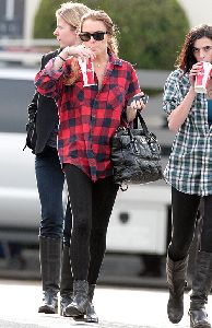 Lindsay Lohan : spotted sipping  cola soda wearing a black tight leggings and a large red and black shirt with her hair tied back in california yesterday 5th January 2009