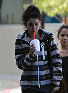 Vanessa Anne Hudgens with a smoothie drink