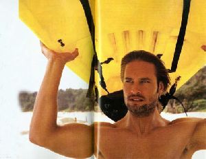 Josh Holloway about to start sea surfing in the ocean