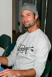 Josh Holloway in a white sweater