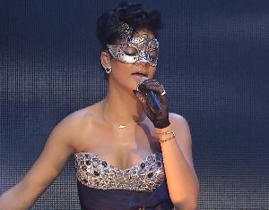 Rihanna stills from a concert wearing an eye-mask