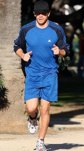 Jake Gyllenhaal wearing a blue adidas sport outfit