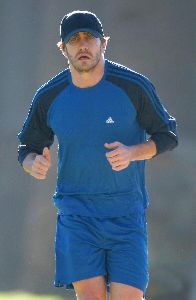 Jake Gyllenhaal running with his his personal trainer on Wednesday in Santa Monica, California 14th of January 2009