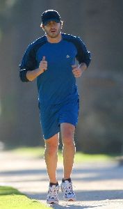 Jake Gyllenhaal running with his his personal trainer on Wednesday in Santa Monica, California 14th of January 2009