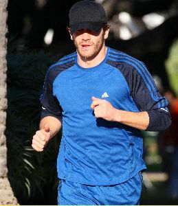 Jake Gyllenhaal running with his his personal trainer on Wednesday in Santa Monica, California 14th of January 2009