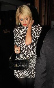 Paris Hilton : wearing an animal print dress heading to Apple Lounge in California on the 13th of January 2009