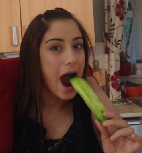 hazal kaya eating a cucumber