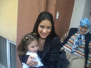 hazal kaya hugging a fan young girl