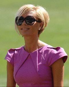 Victoria Beckham : lovely pink dress matched with dark sunglasses and the short bleached hair